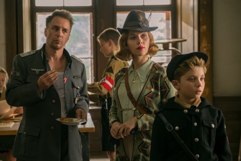 (From L-R): Sam Rockwell, Scarlett Johansson and Roman Griffin Davis in the film JOJO RABBIT. Photo by Larry Horricks. © 2019 Twentieth Century Fox Film Corporation All Rights Reserved
(From L-R): Sam Rockwell, Scarlett Johansson and Roman Griffin Davis in the film JOJO RABBIT. Photo by Larry Horricks. © 2019 Twentieth Century Fox Film Corporation All Rights Reserved